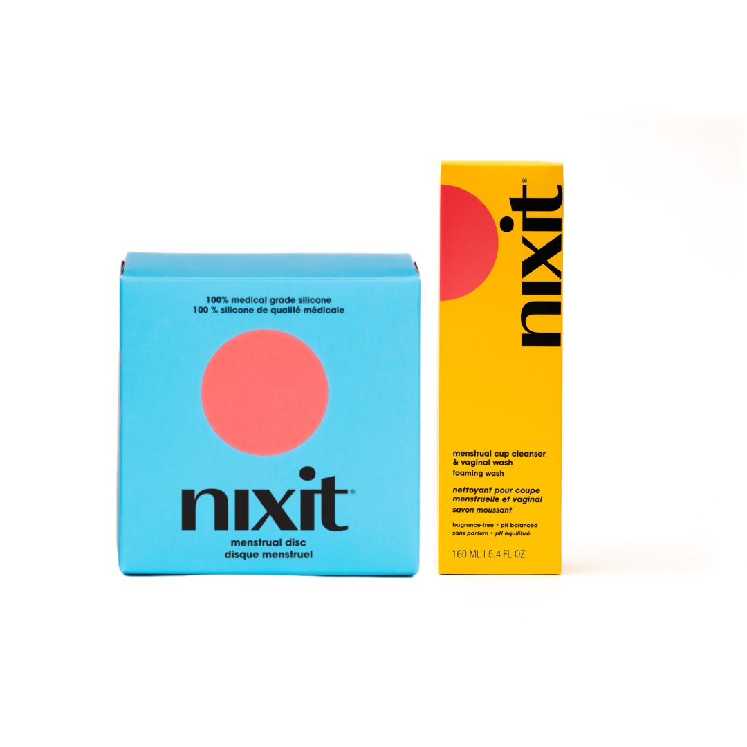 Two Nixit products, a nixit menstrual dix in a blue box and a  menstrual cup cleanswer in a yellow bottle, on a white background.