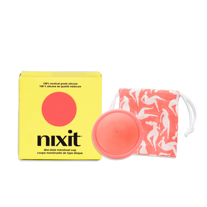 An image of the yellow nixit menstrual cup box which has written on it '100% medical grade silicone' and 'nixit disc-style menstrual cup' with the nixit cup next to it as well as a square cotton bag to keep the menstrual cup in.