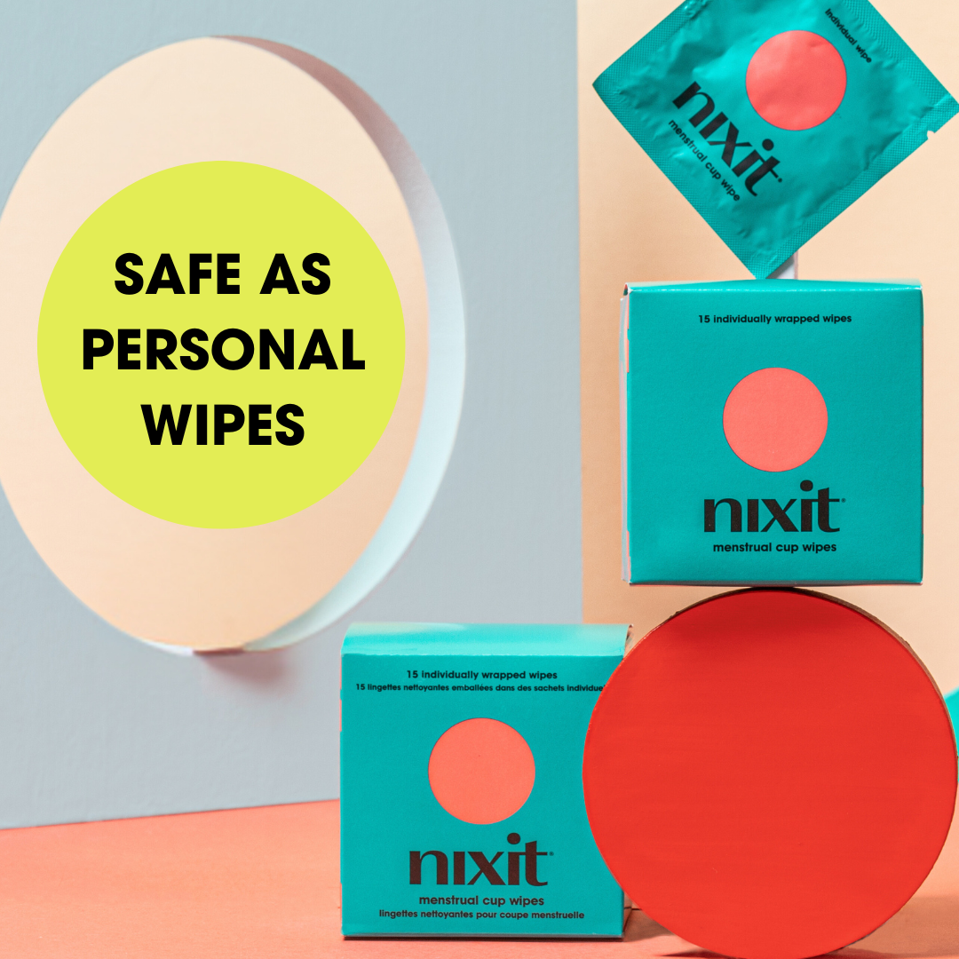 two boxes of nixit menstrual cup wipes are arrange with a individual wipe sachet balancing on top of one box. Words in circle read 'Safe as Personal Wipes'