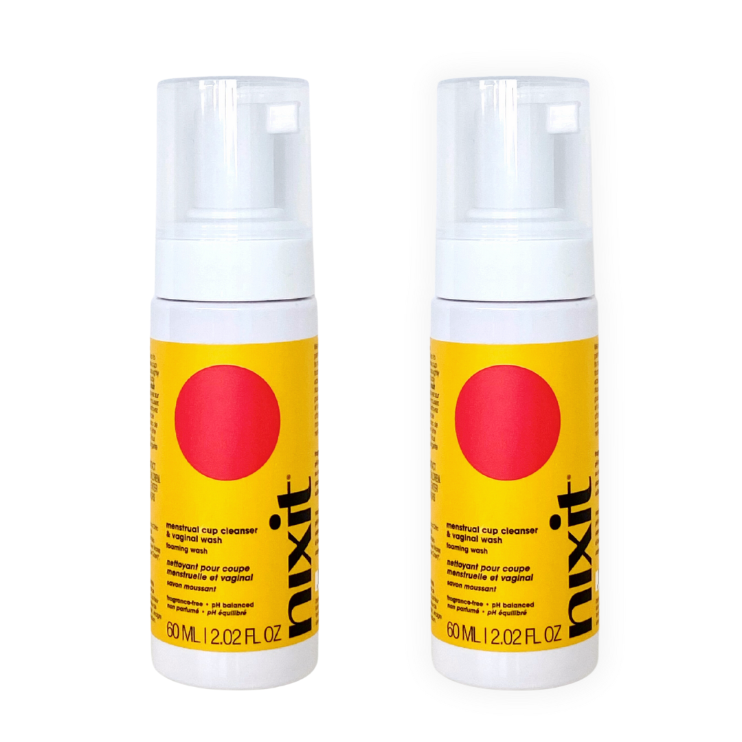 Two bottles of travel size nixit menstrual cup cleanser and vulva wash are side by side